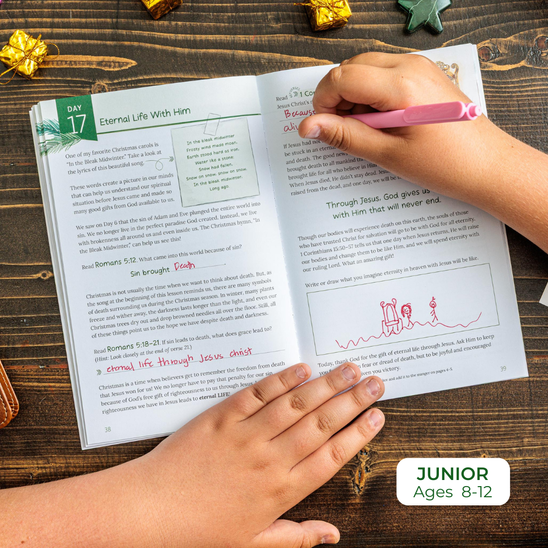 Child&#39;s hands holding a book with writing on a wooden surface, labeled &#39;Junior Ages 8-12&#39;.
