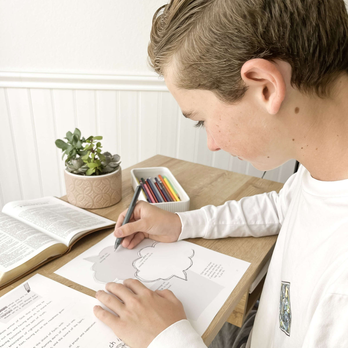Teen working on Scripture Memory Journal
